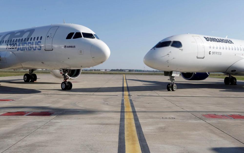 An Airbus A320neo aircraft and a Bombardier CSeries aircraft are pictured during a news conference to announce a partnership between Airbus and Bombardier on the C Series aircraft programme, in Colomiers